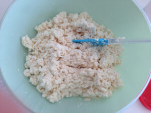 Shreds tapioca root coarsely for textured Nyonya tapioca kueh